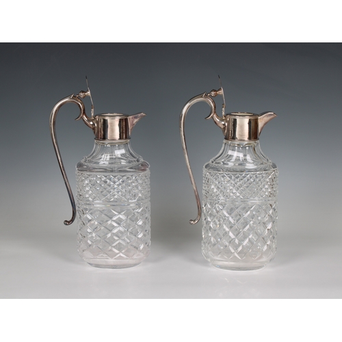 169 - A 20th century clear cut glass water jug with silver plated lid and handle of large proportions, inc... 