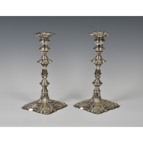 177 - A pair of George II style Edwardian silver weighted candlesticks Thomas Bradbury & Sons Ltd, Sheffie... 