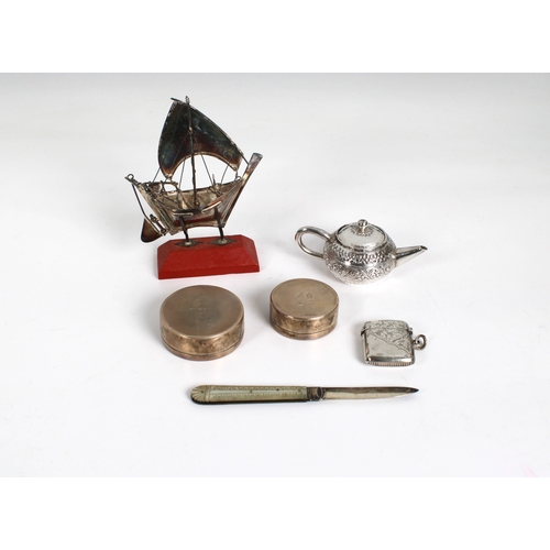 197 - A collection of silver smalls - To include a miniature silver sailing boat marked SILVER 925; Vesta ... 