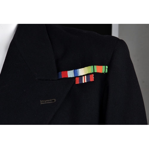 220 - A Royal Navy Uniform Jacket having mounted medal ribbons, bullion wire cuff braid for the rank of Co... 