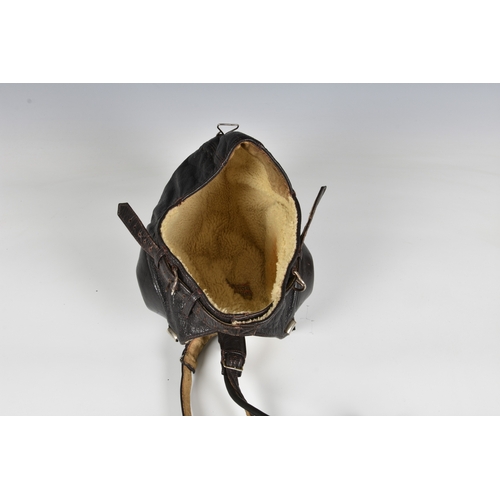 225 - A WWII German Luftwaffe leather winter flying helmet (Fl Kopfhaube) complete with the original Sieme... 