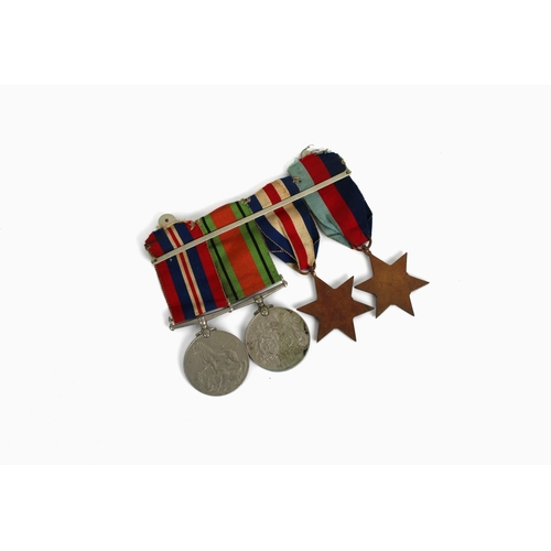 249 - A British WWII military campaign medal group comprising the France and Germany star, 1939-1945 star,... 