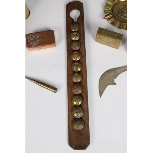 252 - Trench Art - A collection - WWI & WWII (10) comprising buttons in wooden frame; matchbox; Ashtray; p... 