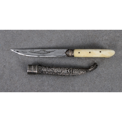 259 - A small Turkish Bichaq type knife 10.8cm. single edged blade, later engraved with foliate design and... 