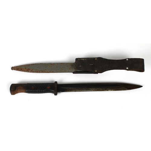 266 - A Second World War German K98 Rifle Bayonet the 24.8cm. single edge fullered blued steel blade stamp... 