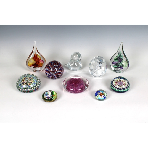 28 - A collection of glass paperweights to include two Poland teardrop paperweights with original sticker... 