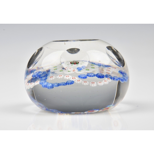 29 - A Baccarat facetted / patterned millefiori glass paperweight the clear glass set with a trefoil garl... 