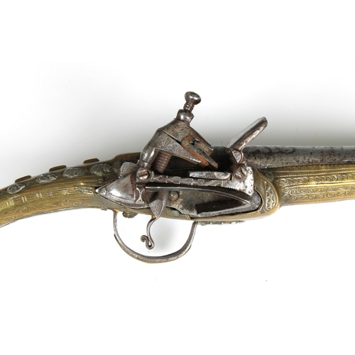 291 - A late 18th or early 19th century Balkan Miquelet flintlock pistol, the full stock and rat tail butt... 