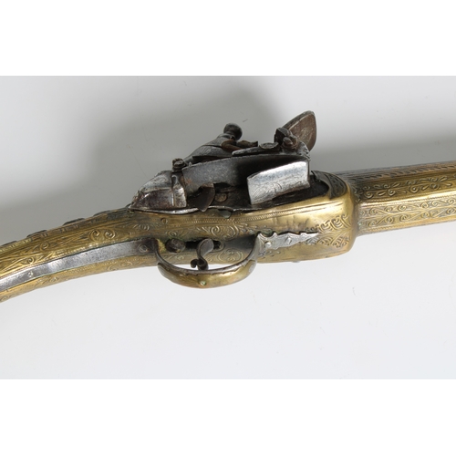 291 - A late 18th or early 19th century Balkan Miquelet flintlock pistol, the full stock and rat tail butt... 