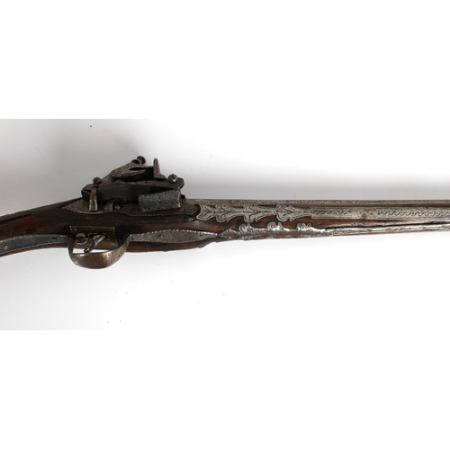 293 - A late 18th or early 19th century Balkan Miquelet flintlock pistol, the rat tail butt in sheet brass... 