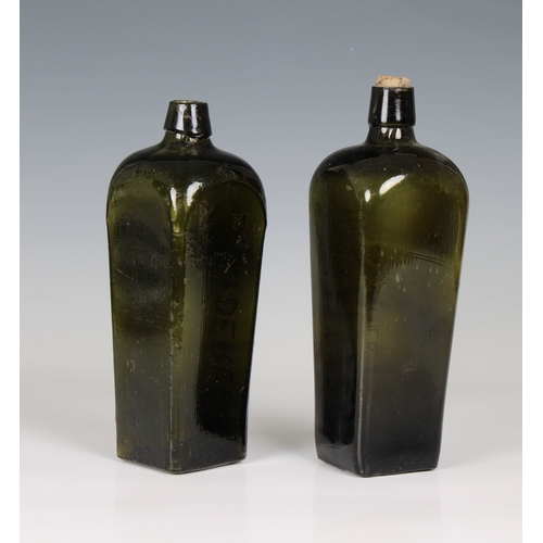 32 - Two Dutch Geneva Gin bottles in dark green, of square tapering form with curved shoulder and short n... 