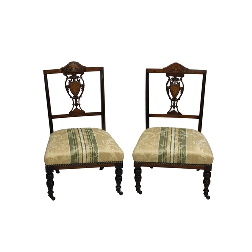 515 - A pair of late Victorian upholstered rosewood nursing chairs with marquetry decoration incorporating... 