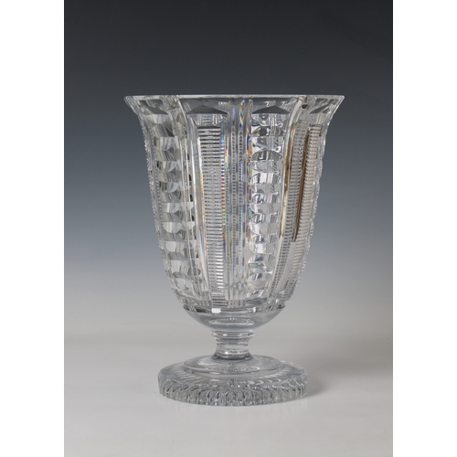 52 - A cut glass footed vase with flared rim on a circular base geometric decoration, 12in. (30.5cm.) hig... 