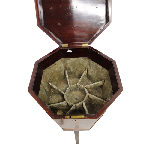 523 - A George III octagonal mahogany wine cooler with brass handles and original lead lining comprising e... 