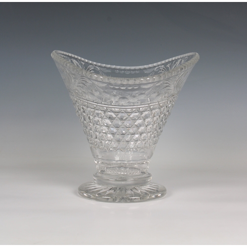 53 - A cut glass footed vase of ovoid form with a flared rim on a circular base scrolling and floliate de... 