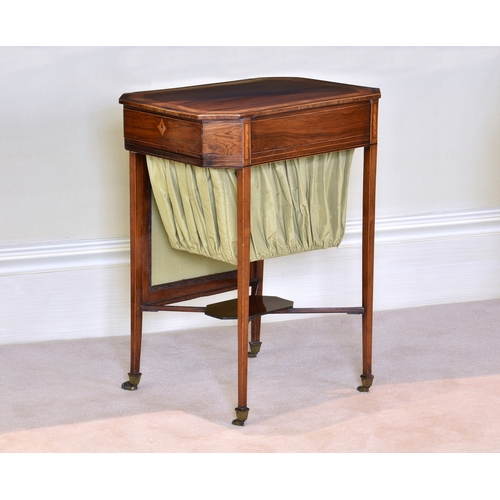 536 - A George IV rosewood and satinwood octagonal work table the satinwood banded top over a single fitte... 