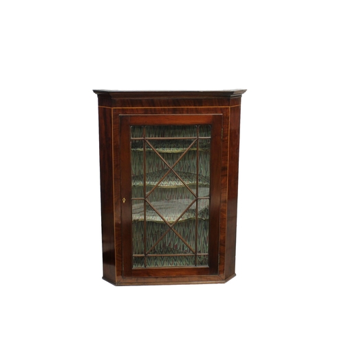 557 - A mahogany and inlaid glazed corner cabinet