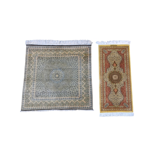 565 - Two small part silk rugs by National Iranian Carpets one Qum rug, signed, 39 x 38in. (99 x 96.5cm.),... 