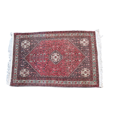 570 - An Abadeh rug with a central medallion repeated to corners, within an extended lozenge field flanked... 