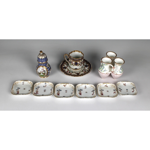 58 - A collection of ceramics - to include a 20th century Dresden pear shaped sugar caster having hand pa... 