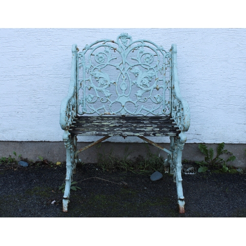 580 - A Victorian painted cast iron garden seat with arms, in the manner of Coalbrookdale fruiting vine de... 