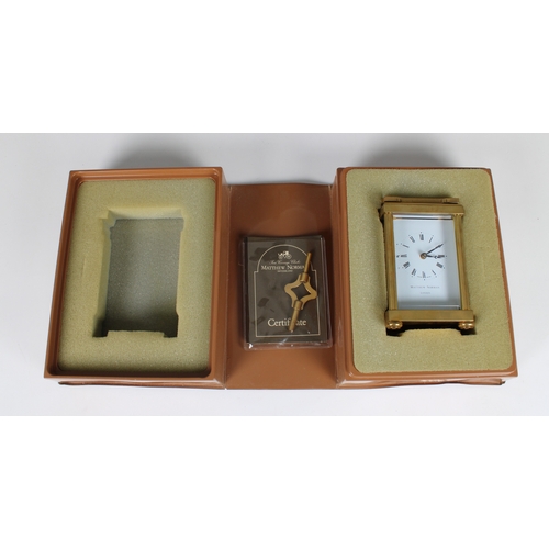 586 - A Matthew Norman carriage clock 20th Century, with visible escapement, white dial with Roman numeral... 