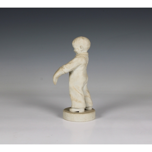 75 - A Parian Ware figure of a young boy putting on a mitten and resting against a spade impressed mark 