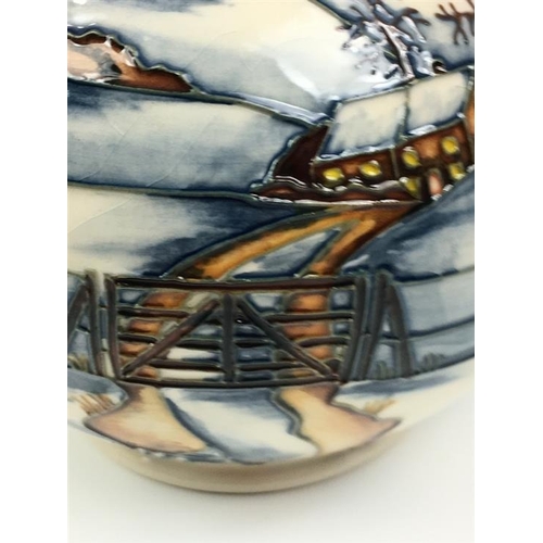 79 - A Moorcroft Woodside Farm pattern baluster vase dated 1999, decorated with foxes in a snowy landscap... 