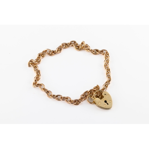 669 - A 9ct yellow gold charm bracelet The delicate charm bracelet of cable chain with heart shaped lock.