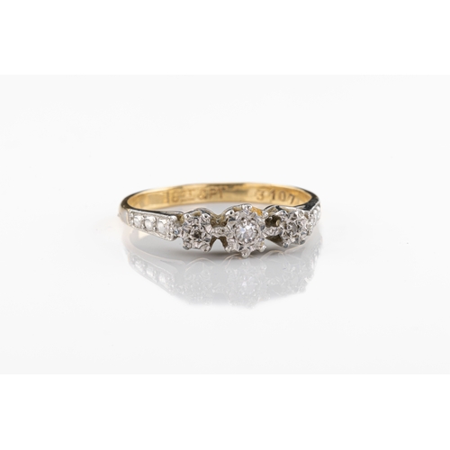 683 - An 18ct yellow gold, platinum and diamond ring The three mixed round cut diamonds framed with decora... 