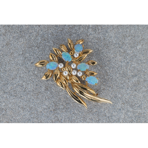 686 - A 9ct gold, water opal and seed pearl spray brooch 42mm. long.