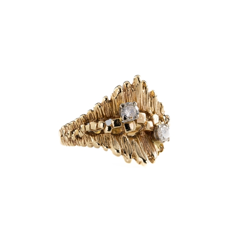 687 - A 9ct yellow gold and diamond dress ring The ring of bark design, set with two brilliant cut diamond... 