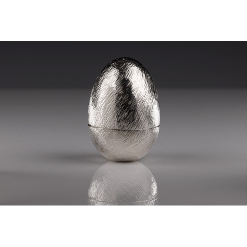 717 - A Nerine Sarniensis Surprise Egg Bruce Russel & Son crafted egg on stand in silver and 18ct yellow g... 