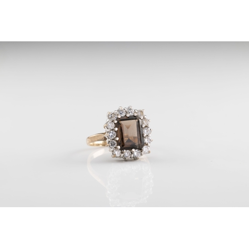 784 - A bronzite and diamond cluster ring The step cut bronzite within a diamond surround of fourteen bril... 