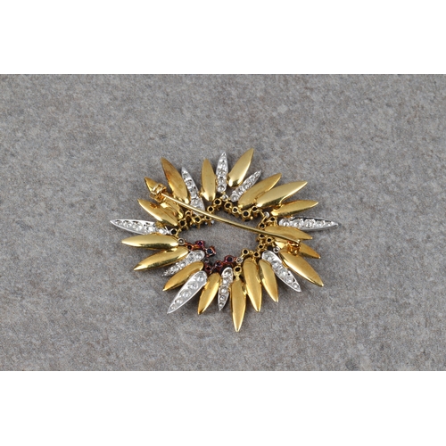 810 - A vintage modernist 18ct two colour gold, sapphire and diamond sunburst brooch the textured yellow g... 