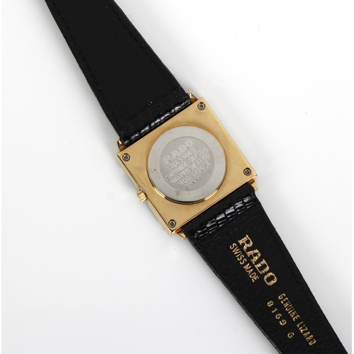 851 - A Rado Florence gold plated and black ceramic watch bearing the logo of the Omani Olympic team on th... 