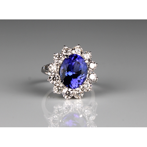 691 - Certificated, large 18ct white gold AAA tanzanite and diamond cluster ring oval-cut tanzanite 4.95ct... 