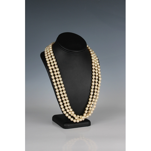 693 - A single strand cultured pearl necklace Golden pearl necklace the strand approximately 74in. (188cm.... 