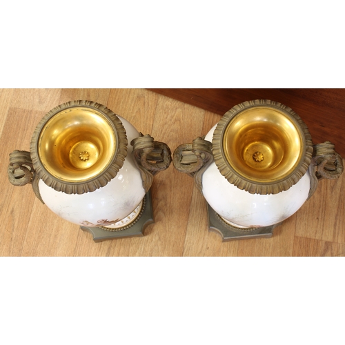 70A - A pair of Sevres style porcelain urn shaped lidded vases ormolu mounted, hand painted with elegant f... 