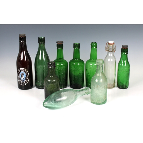 1069 - A collection of vintage / antique Guernsey bottles to include J.Harris Bank House Guernsey, emerald ... 