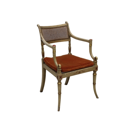 193 - Regency style painted caned elbow chair the fluted top rail and turned stiles to out-swept arms with... 