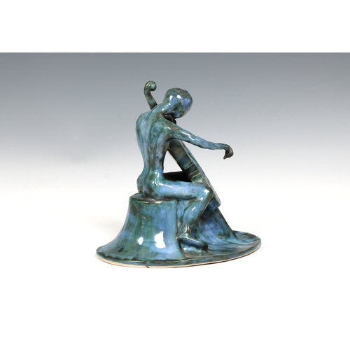 2 - Guernsey Studio pottery - Elizabeth Ann Macphail (1939-89) A turquoise glazed stylised cellist or do... 