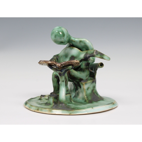 22 - Guernsey Studio pottery - Elizabeth Ann Macphail (1939-89) A stylised green glaze lute player sculpt... 