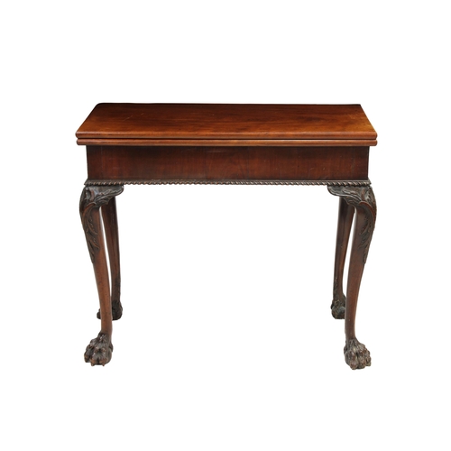 222 - A George II flame mahogany tea table with a fold over top, carved cabriole legs and lion's paw feet,... 