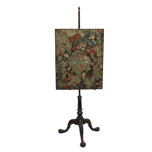 223 - A 19th century mahogany pole screen featuring a needlepoint tapestry of a stylised floral design fra... 