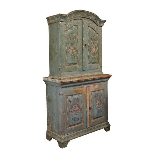 229 - An 18th century Swedish painted pine cupboard the arched cornice over two painted doors opening to s... 