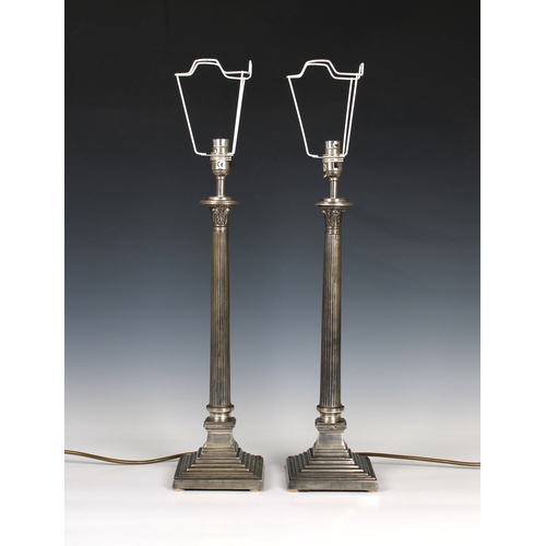 235 - A pair of stepped column form metal table lamps 21¼ inches (54cm) high