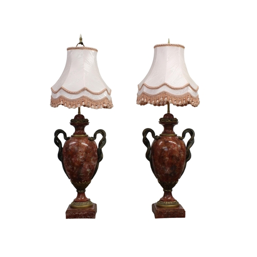 238 - A pair of Thomas Blakemore table lamps parcel gilt faux rosso antico marble, with entwined serpent h... 