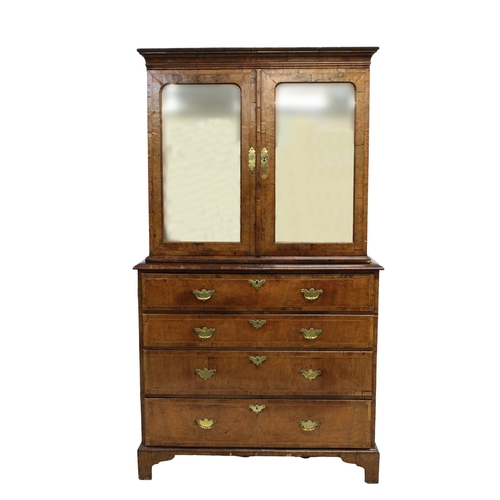 240 - A fine George I walnut secretaire cabinet on chest, upper section with laburnum interior the flared ... 