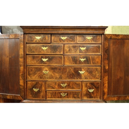 240 - A fine George I walnut secretaire cabinet on chest, upper section with laburnum interior the flared ... 